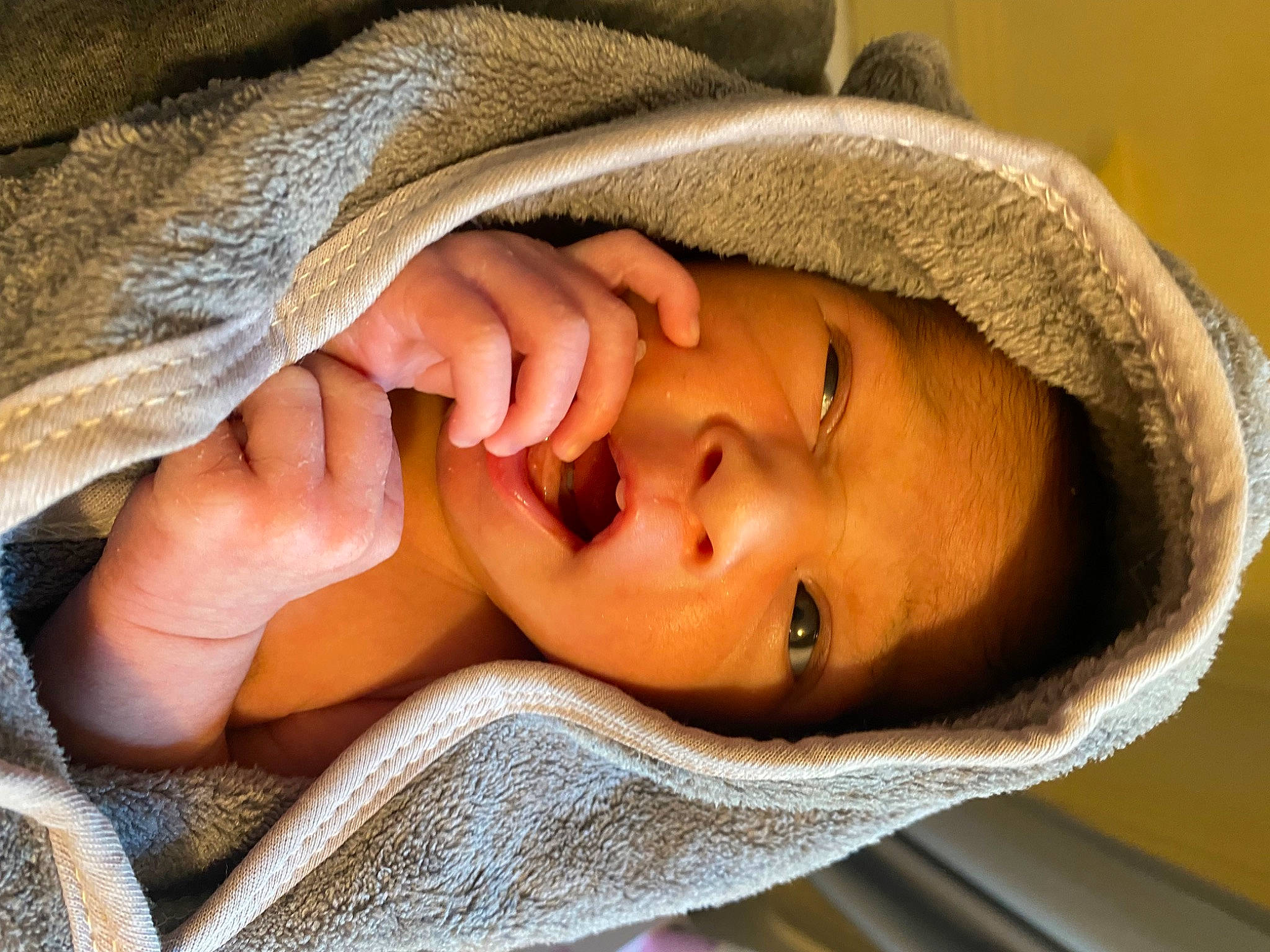 Emilio is registered to the contest to win money with this photo: chin, comfort, eye, eyebrow, eyelash, finger, gesture, hand, happy, head, human_body, linens, lip, mouth, neck, nose, person, skin, smile, textile