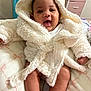 Zori joined the competition — help win amazing prizes! baby, blanket, child, comfortable, cute, drawer, fluffy_clothing, furniture, happy, hooded_jacket, indoor, infant, person, pink, portrait, smiling, socks, soft_texture, warm_clothing, white