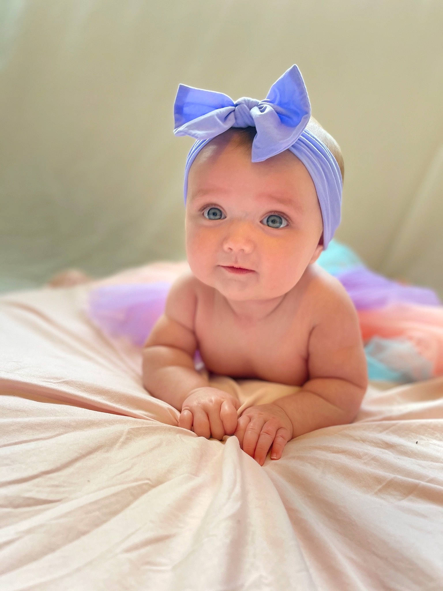 Tilly is registered to the contest to win money with this photo: baby, baby_toddler_clothing, blue, child, comfort, costume_hat, event, facial_expression, flash_photography, fun, happy, headgear, headpiece, headwear, linens, magenta, peach, person, pink, sitting