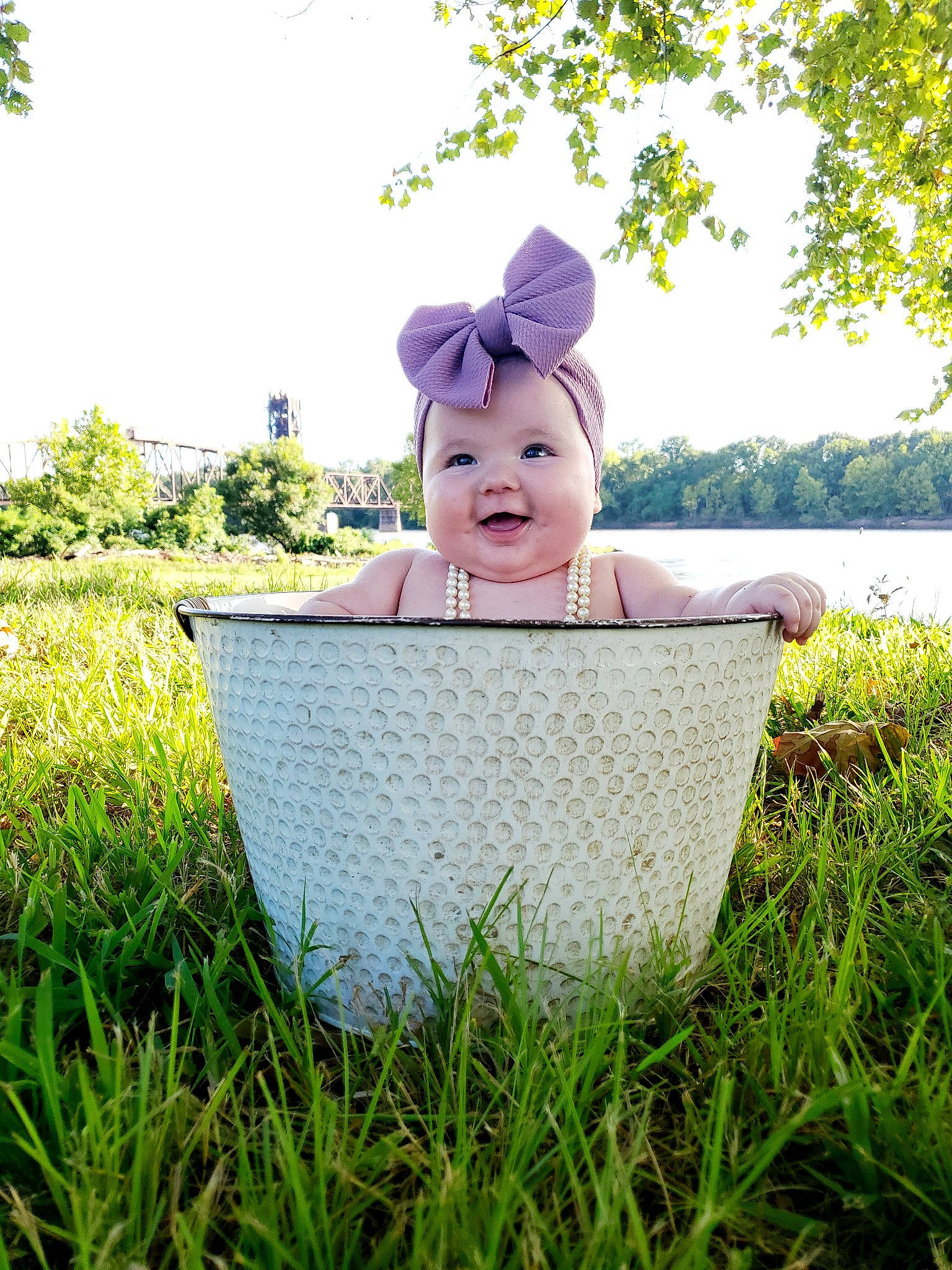 Dawson is registered to the contest to win money with this photo: baby, baby_toddler_clothing, beauty, cap, costume_hat, grass, grassland, happy, hat, headwear, lawn, leisure, meadow, outerwear, people_in_nature, person, plant, sky, smile, sunlight