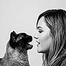 animal, black_and_white, cat, closeup, communication, cute, expression, face_to_face, feline, furry, hair, human, indoor, interaction, monochrome, pet, portrait, profile, siamese_cat, woman