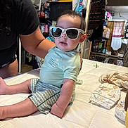 Cruz Carlos joined the competition — help win amazing prizes! baby, sunglasses, bed, person, arm, dog, indoor, clothing, shorts, shirt, diapers, curtains, furniture, pet, gate, window, light, room, casual, cute