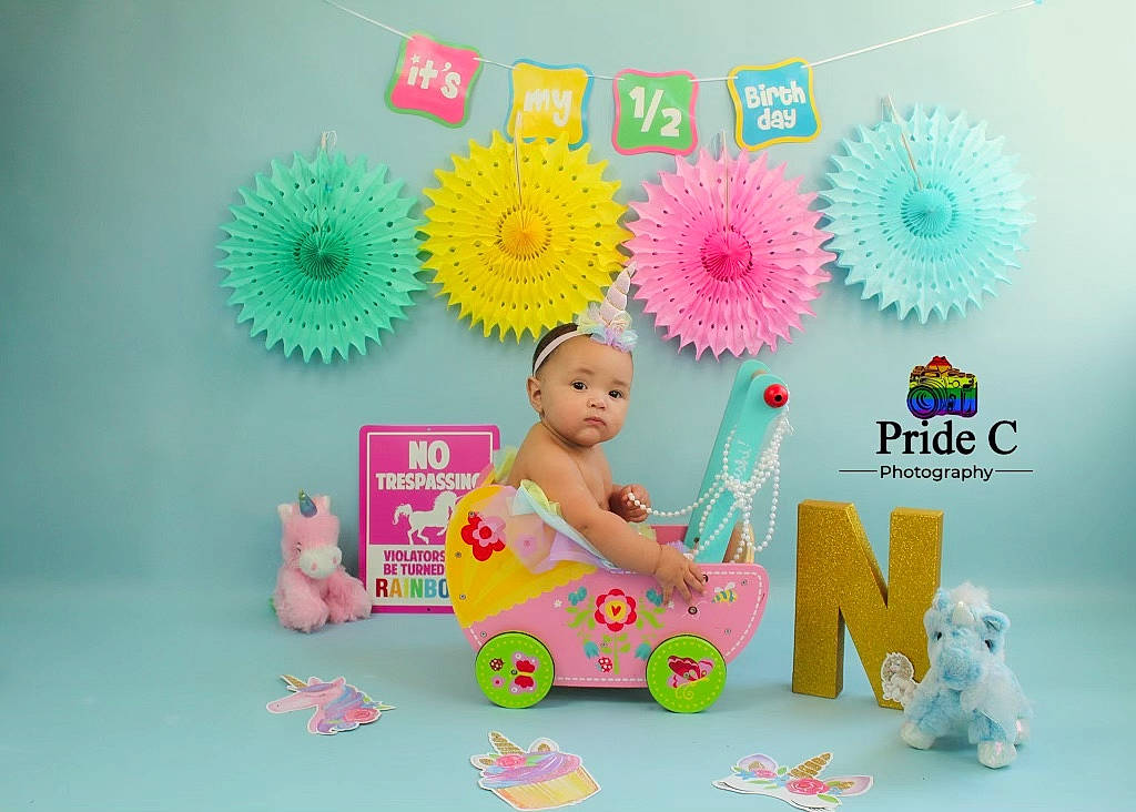 Nyonna is registered to the contest to win money with this photo: aqua, art, baby, baby_toddler_clothing, child, design, fashion_accessory, font, fun, happy, magenta, paper, paper_product, party_supply, person, pink, play, product, stationery, toddler