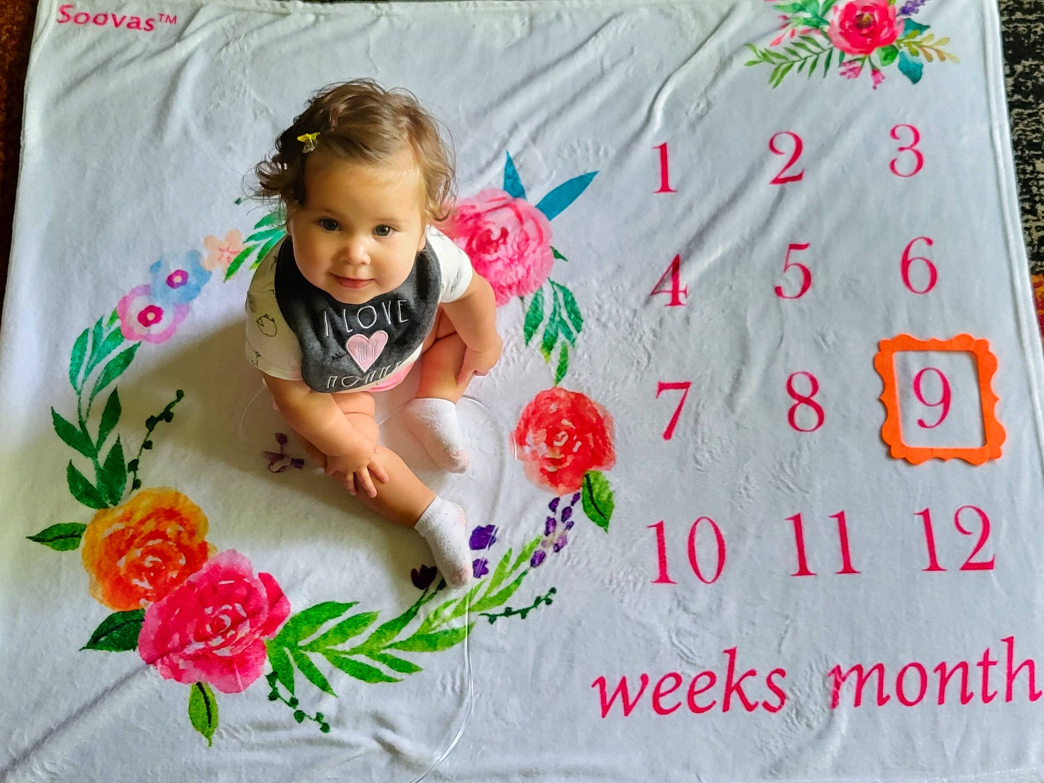 Noel is registered to the contest to win money with this photo: baby, baby_toddler_clothing, child, cut_flowers, design, event, floral_design, flower, flower_arranging, font, greeting, happy, magenta, pattern, person, petal, pink, plant, product, sleeve