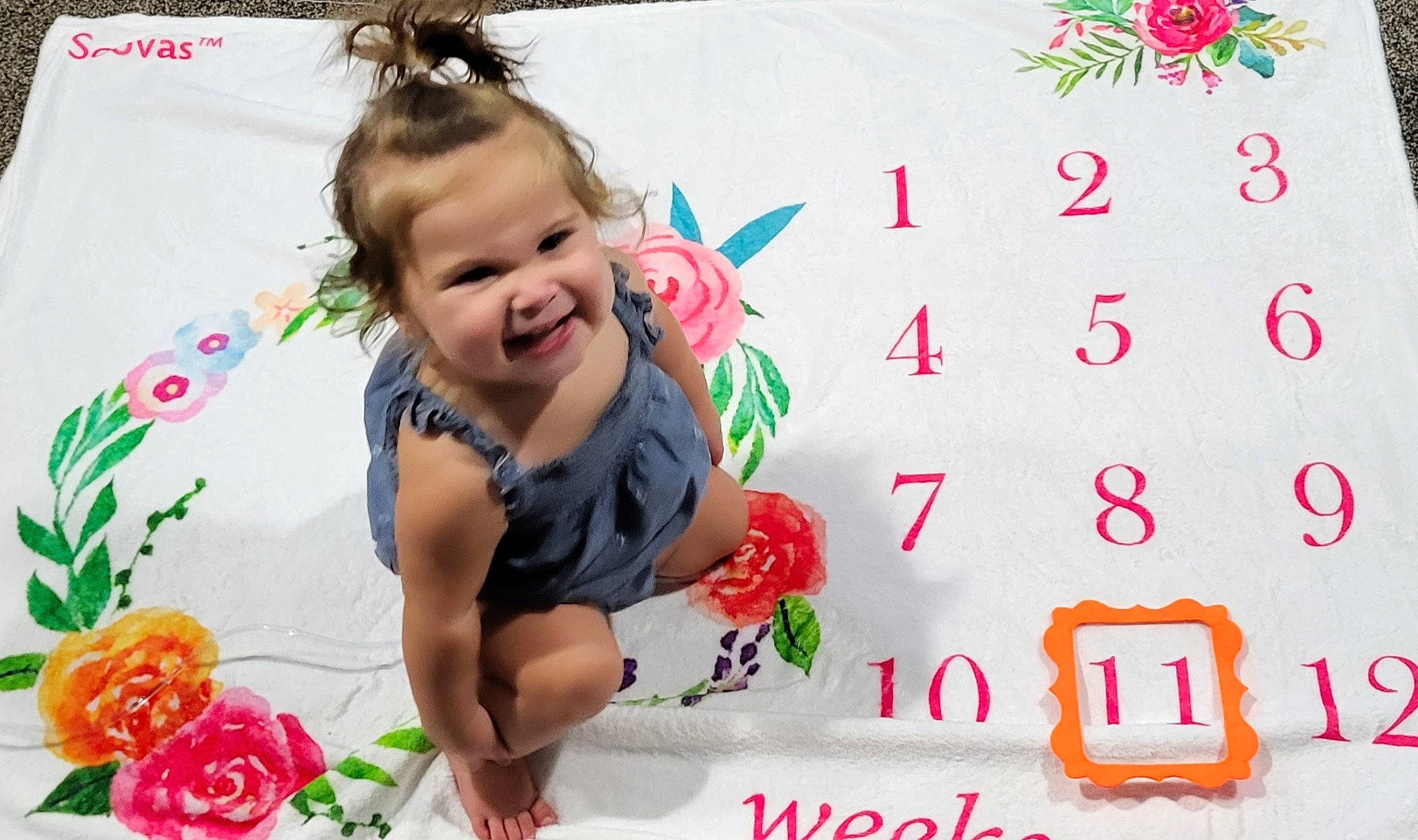 Noel is registered to the contest to win money with this photo: baby, baby_toddler_clothing, child, event, facial_expression, flower, font, fun, happy, joy, pattern, people_in_nature, person, petal, pink, plant, play, red, rose, smile