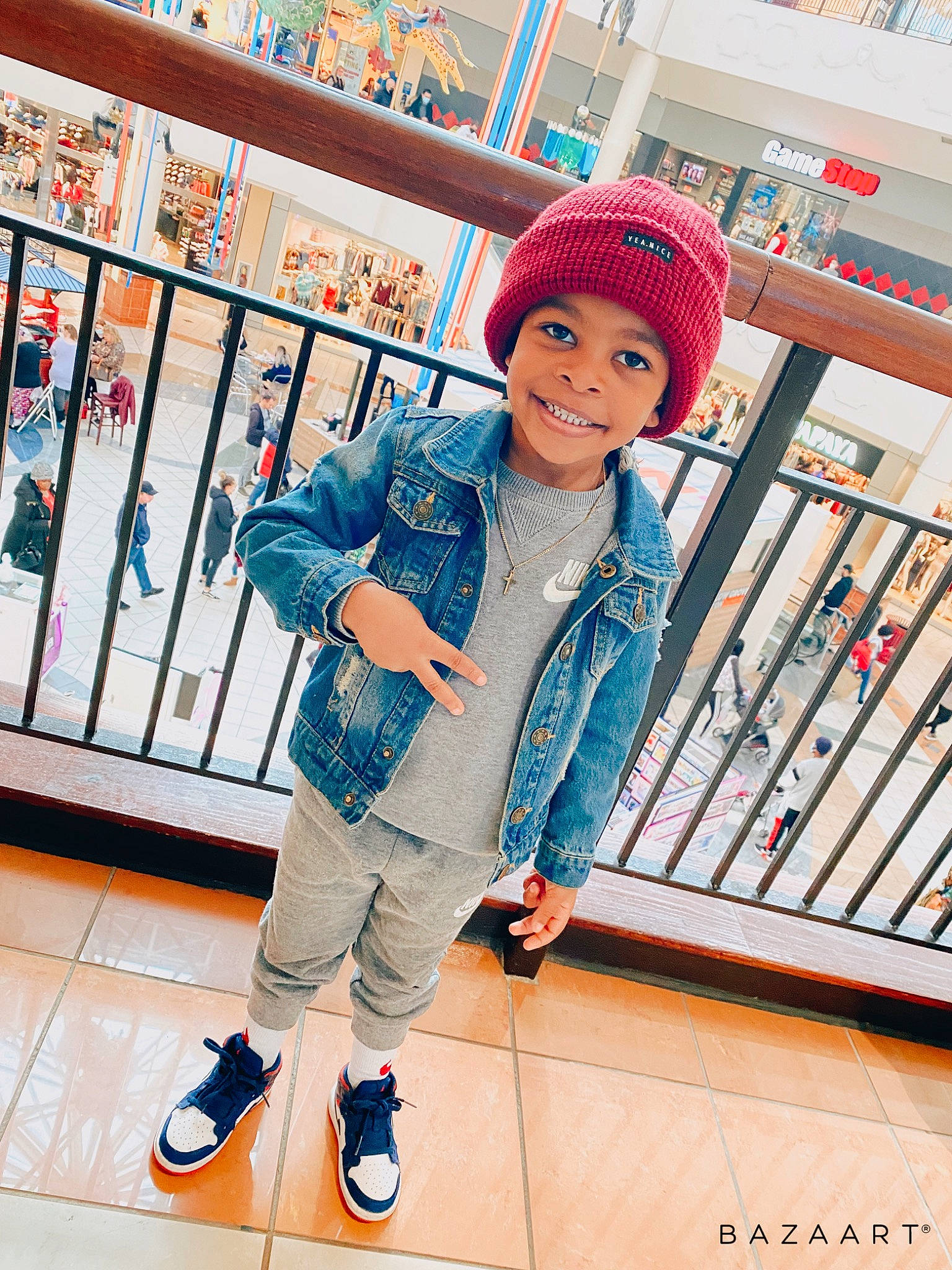 Karter is registered to the contest to win money with this photo: bag, cap, child, denim, electric_blue, fashion, footwear, fun, happy, headwear, joy, leisure, luggage_and_bags, outdoor_shoe, person, shoe, sleeve, smile, sneakers, standing