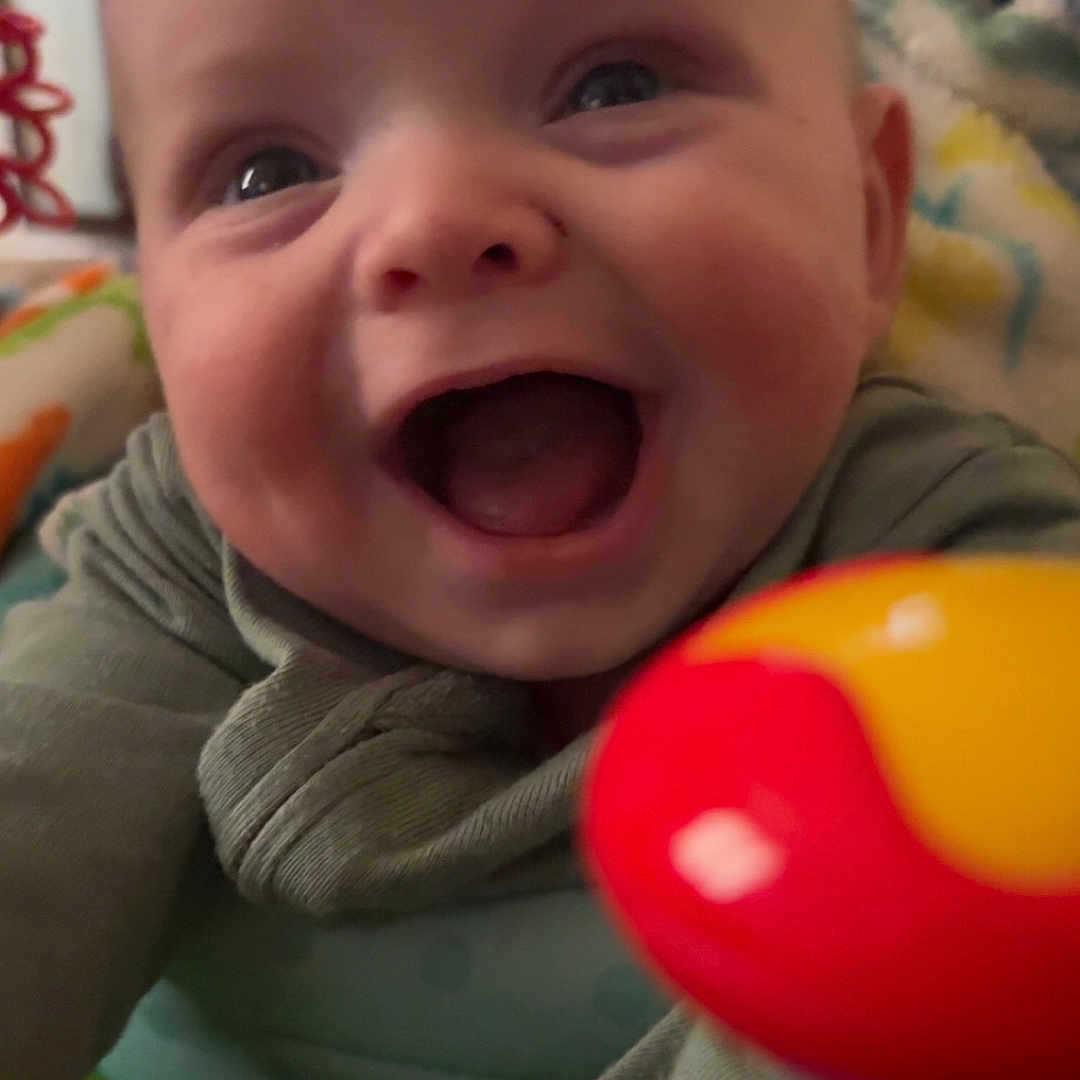 Chance Palmer joined the competition — help win amazing prizes! baby, babylaughing, bodypart, couch, face, finger, furniture, hand, happy, head, inflatable, laughing, mouth, newborn, person, photography, portrait, smile, teeth, toy