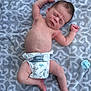 baby, newborn, sleeping, diaper, pacifier, towel, pattern, infant, skin, cute, peaceful, lying_down, relaxed, small, child, human, arms, legs, indoors, soft