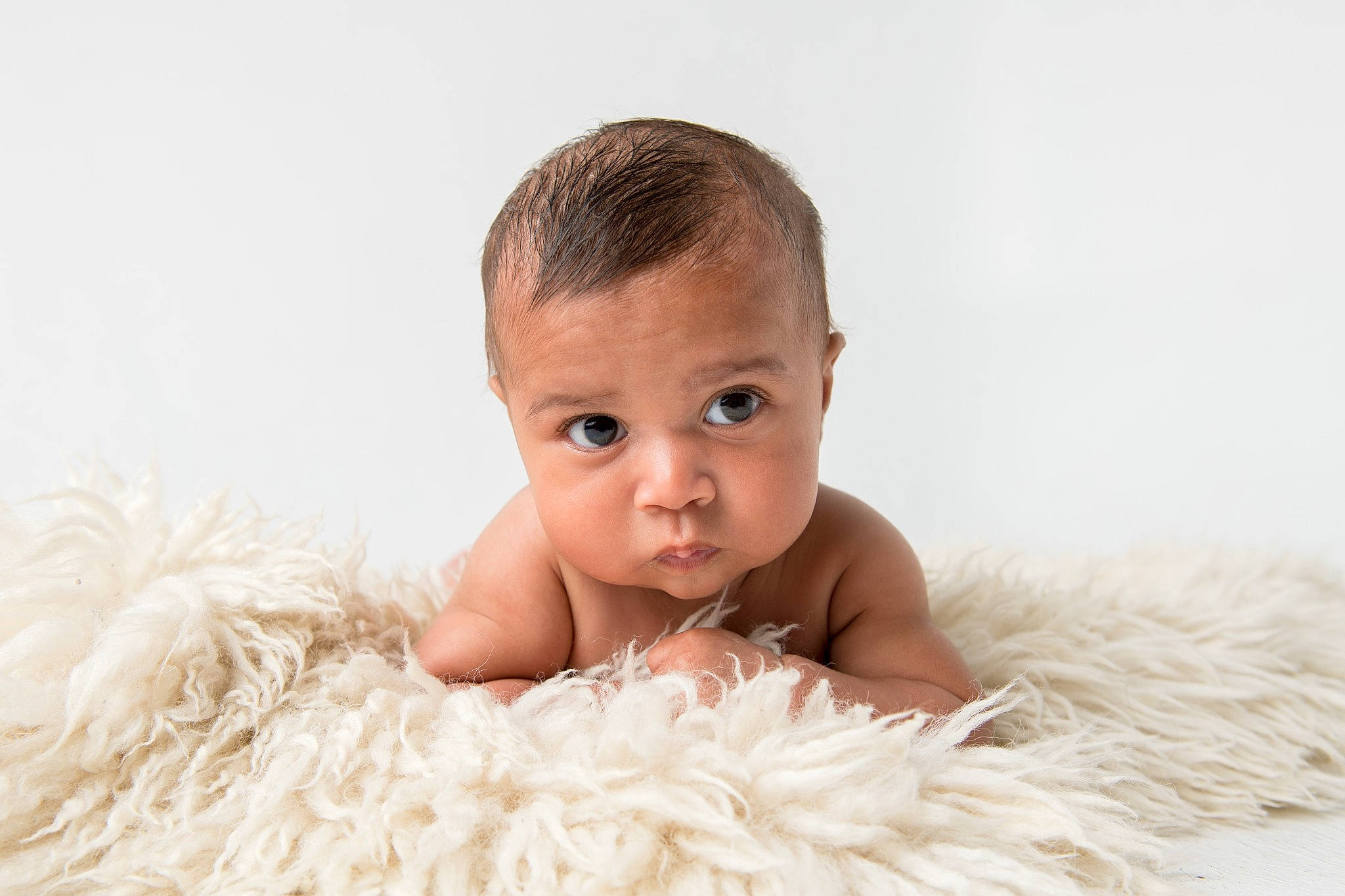 Santiago joined the competition — help win amazing prizes! baby, baby_toddler_clothing, bathing, cheek, child, child_model, eyelash, fashion_accessory, feather, flash_photography, fun, fur, happy, iris, person, portrait, portrait_photography, sitting, smile, toddler