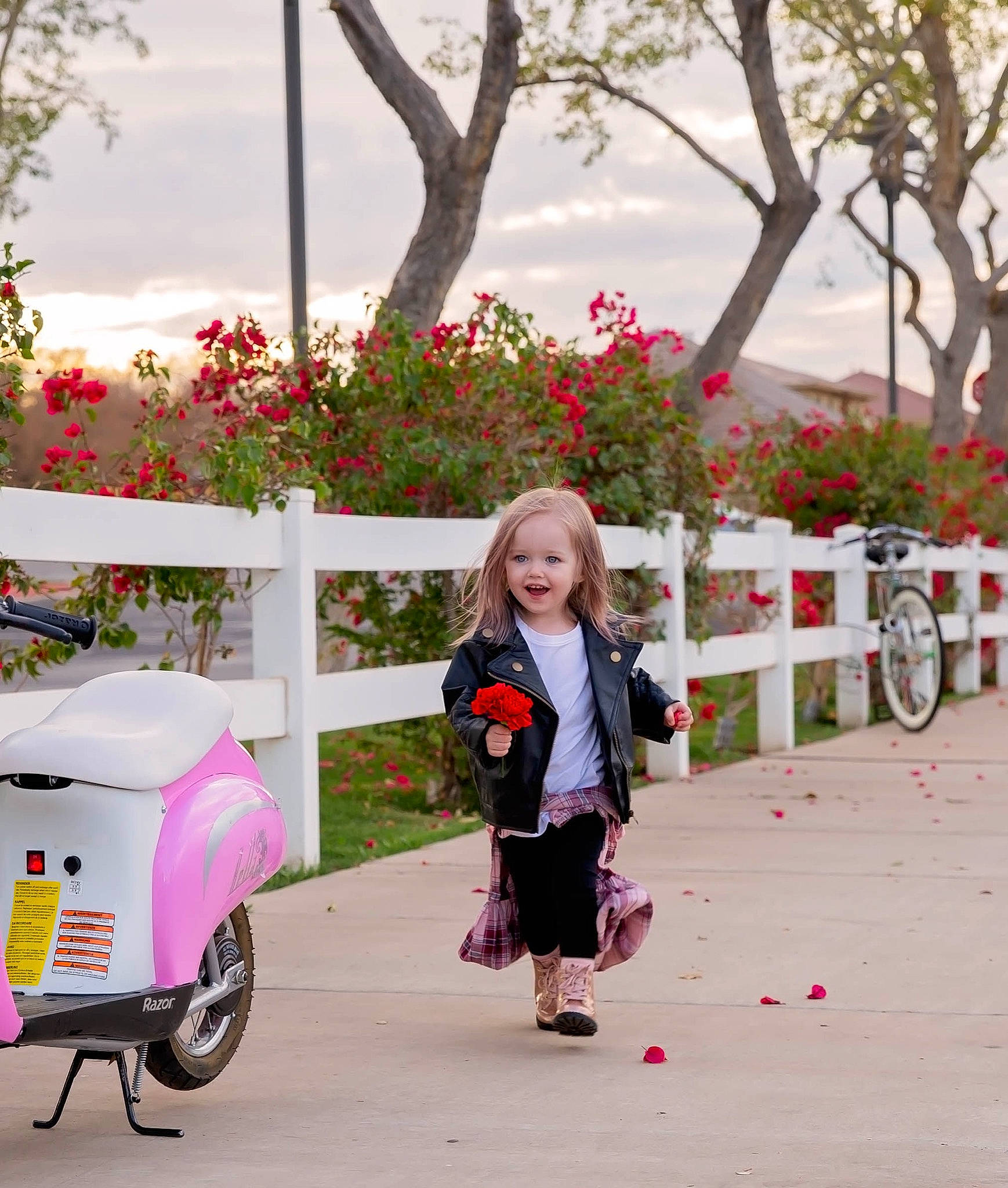 Lyla joined the competition — help win amazing prizes! event, flower, happy, leisure, magenta, person, photograph, pink, plant, product, recreation, red, smile, street_fashion, tire, toddler, travel, tree, wheel, white