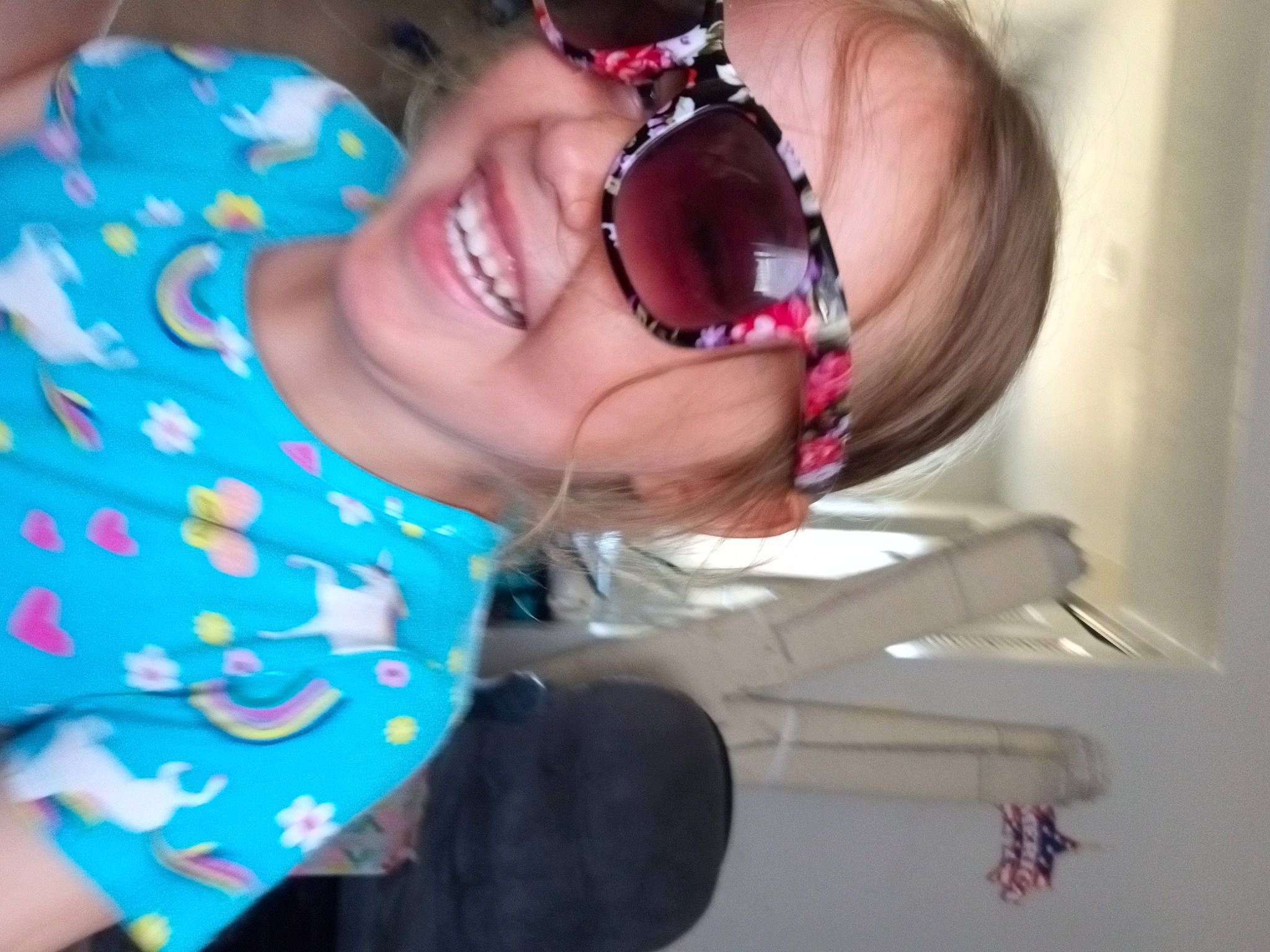 Allison Barton is registered to the contest to win money with this photo: cheek, eye, eyelash, eyewear, fun, gesture, glasses, happy, human_body, jaw, joy, lip, mouth, nose, person, pink, skin, smile, sunglasses, toddler