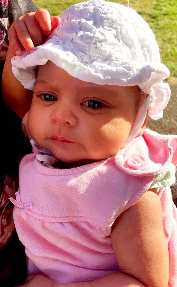 Alisa is registered to the contest to win money with this photo: baby, bonnet, cheek, child, face, hair_accessory, head, headgear, headwear, lip, person, pink, skin, toddler