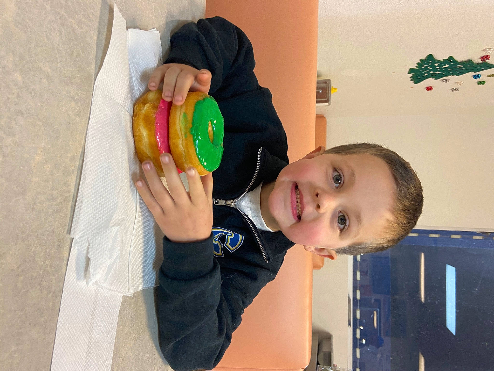 Shooter is registered to the contest to win money with this photo: baby, child, drinkware, event, fun, happy, leisure, nail, party_supply, person, play, room, smile, standing, t_shirt, tableware, toddler