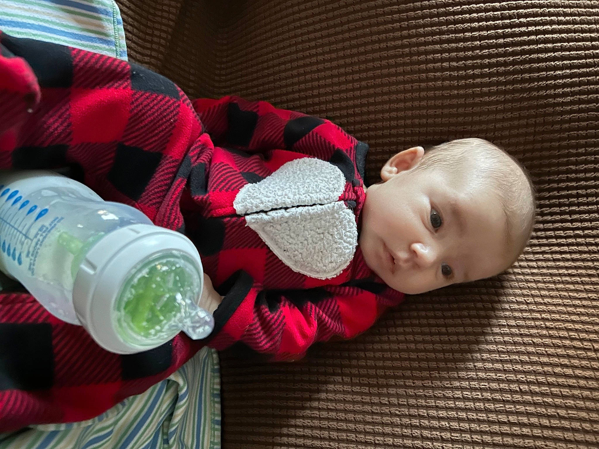 Harper joined the competition — help win amazing prizes! baby, baby_toddler_clothing, beauty, child, comfort, design, drink, drinking, drinkware, fluid, grass, liquid, person, plastic_bottle, product, sitting, sleeve, textile, toddler, water