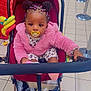 toddler, child, stroller, pacifier, pink_jacket, colorful_hair, supermarket, shopping_basket, floor_tiles, baby, toy, water_bottle, clothing, indoor, person, shopping_cart, cute, seated, portrait, retail