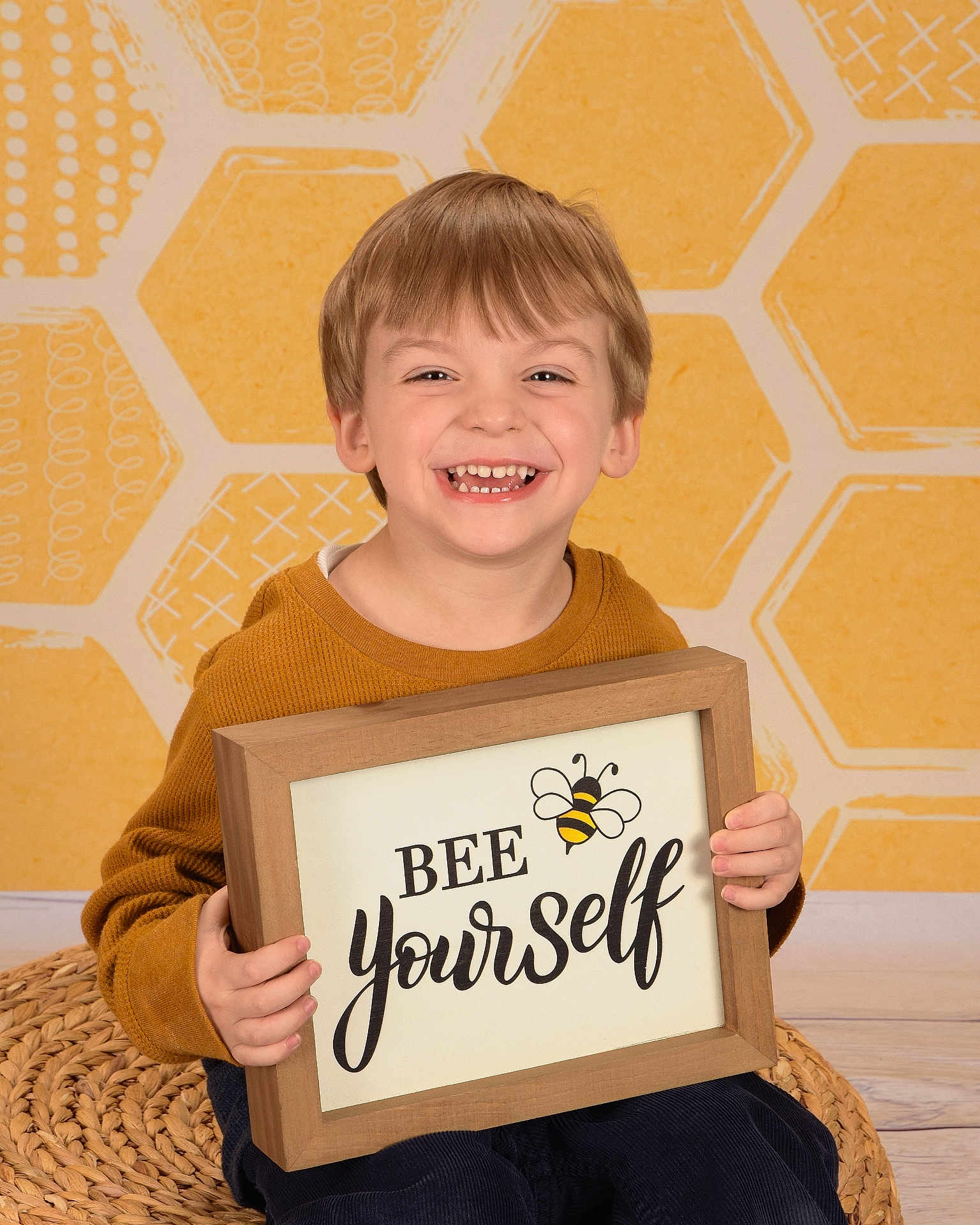 Elijah is registered to the contest to win money with this photo: blonde, bodypart, boy, child, clothing, face, finger, hand, happy, head, male, person, photoframe, photography, portrait, sitting, smile, t_shirt, text, wood