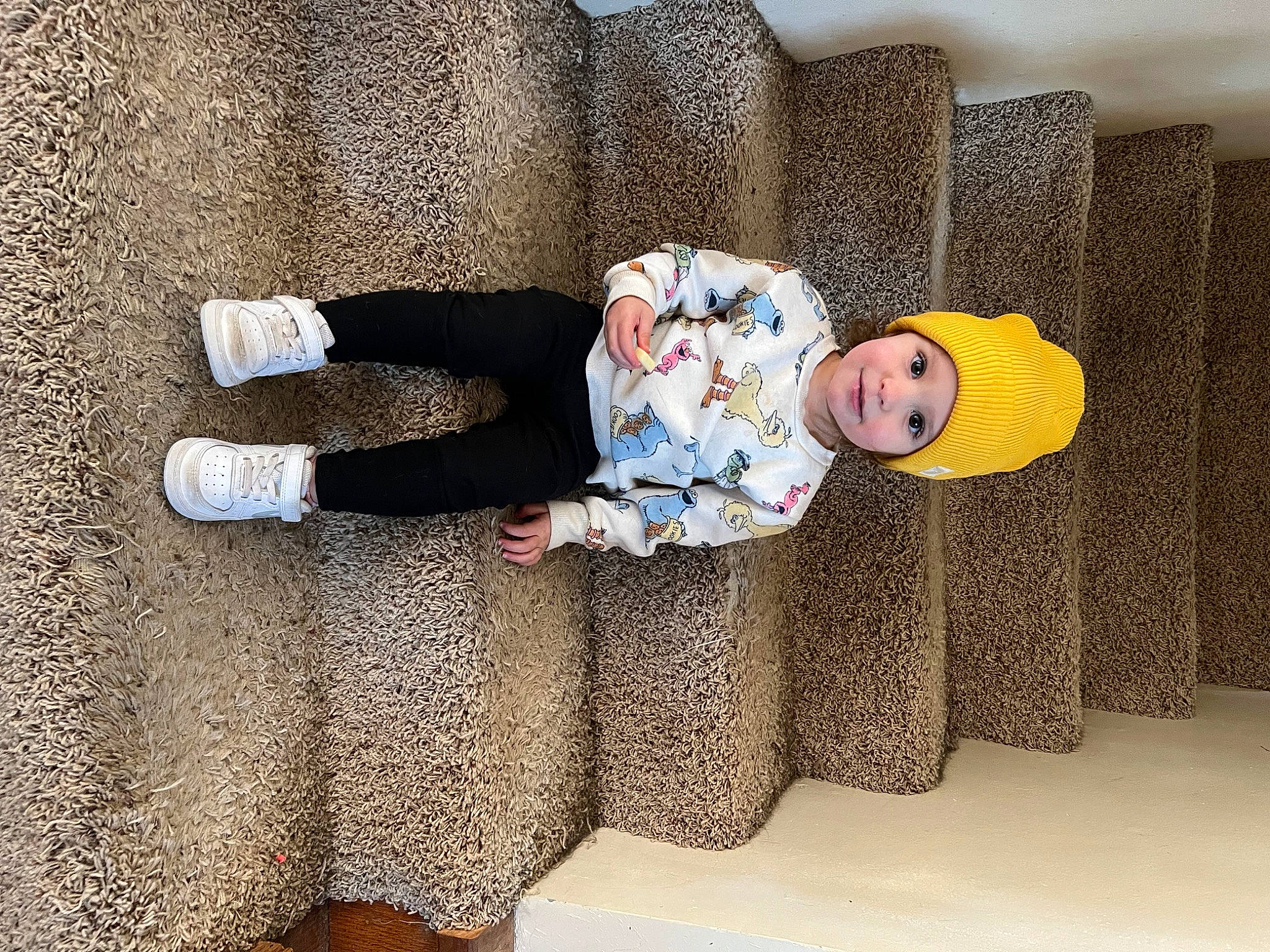 Charli joined the competition — help win amazing prizes! art, baby, baby_toddler_clothing, child, comfort, flooring, fun, hat, headwear, human_body, human_leg, linens, pattern, person, room, sitting, sleeve, sock, textile, toddler