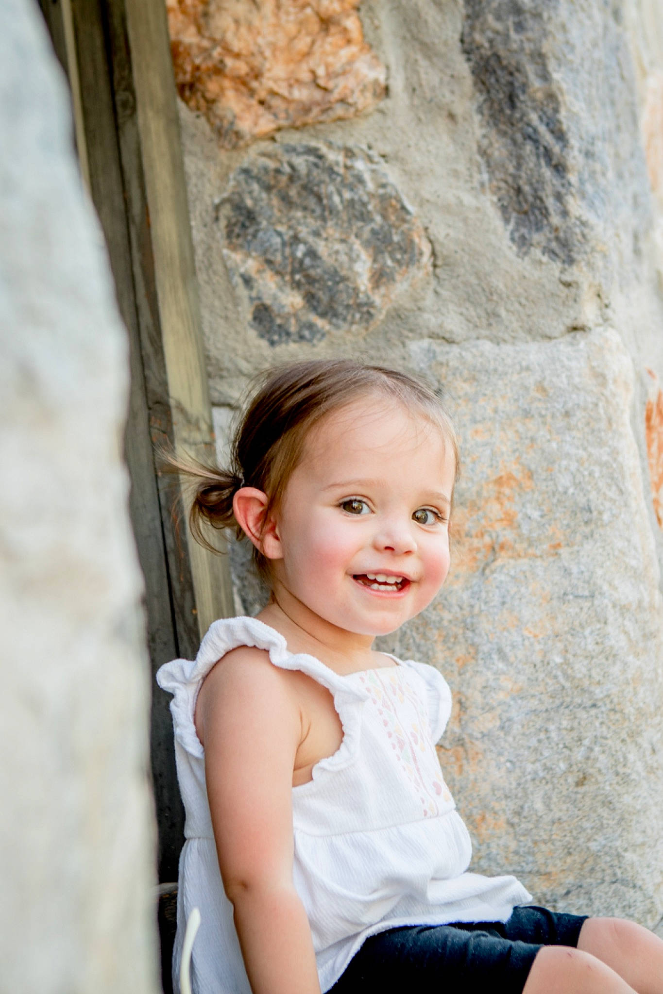 Charli joined the competition — help win amazing prizes! azure, blond, child, eye, facial_expression, flash_photography, fun, happy, joy, leisure, person, rock, sitting, skin, smile, standing, toddler, tree, trunk, vacation