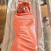 Sophia is registered to the contest to win money with this photo: newborn, baby, swaddled, blanket, headband, sleeping, bassinet, hospital, striped_blanket, infant, baby_clothing, peaceful, cute, indoors, soft_light, portrait, child, resting, wrapped, pink