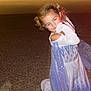 child, costume, princess, dress, sparkly, night, outdoor, pose, playful, shy, gravel, road, car, blur, lights, young, person, fun, happy, cute