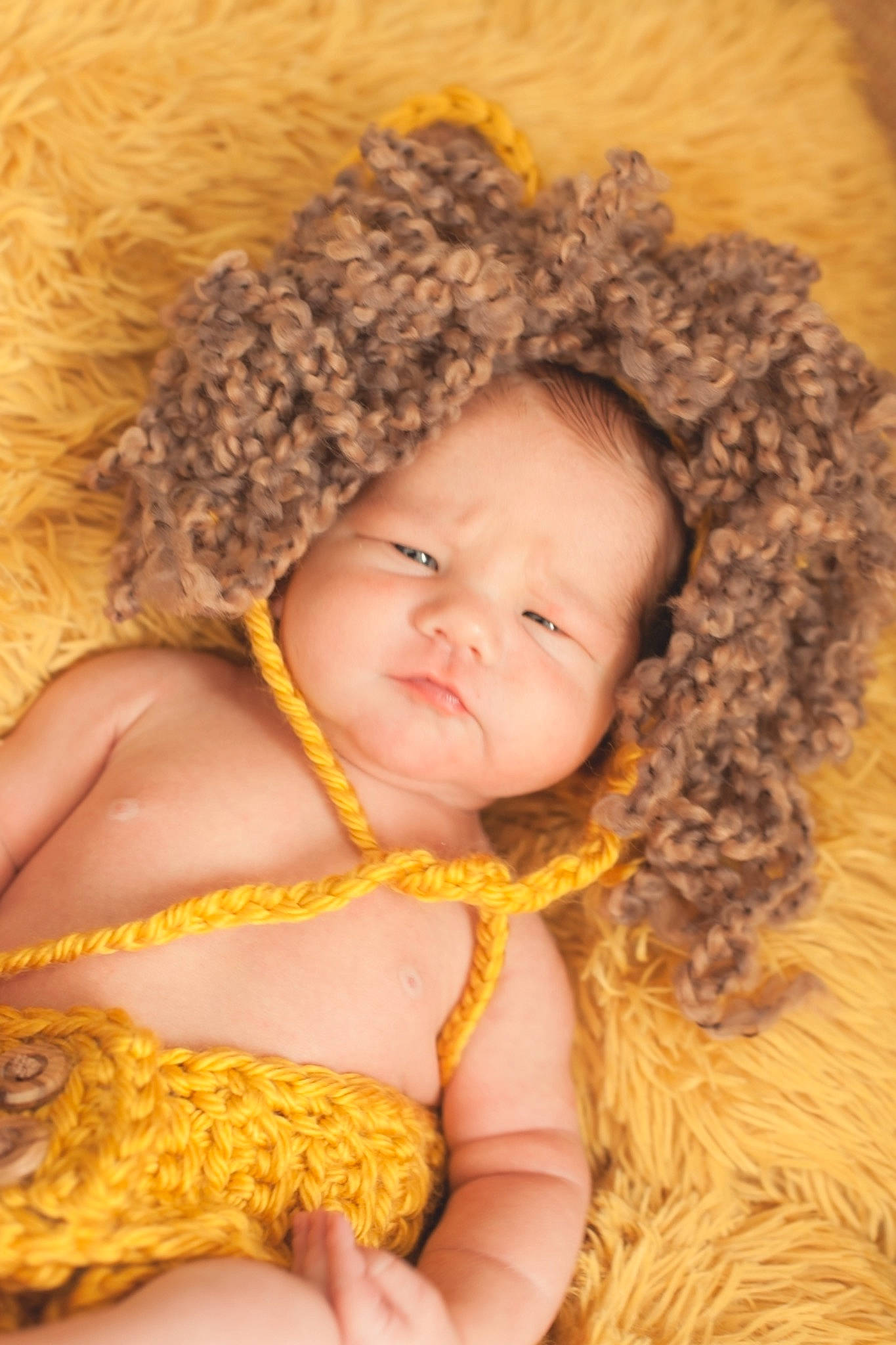 Henry is registered to the contest to win money with this photo: baby, baby_toddler_clothing, comfort, eye, fawn, happy, head, headgear, iris, lip, mammal, neck, nose, outerwear, person, ringlet, skin, textile, toddler, wool