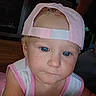 toddler, child, face, blue_eyes, cap, pink_cap, pink_clothing, sleeveless_shirt, indoor, closeup, person, curious, baby, headwear, expression, skin, portrait, young_child, human, casual
