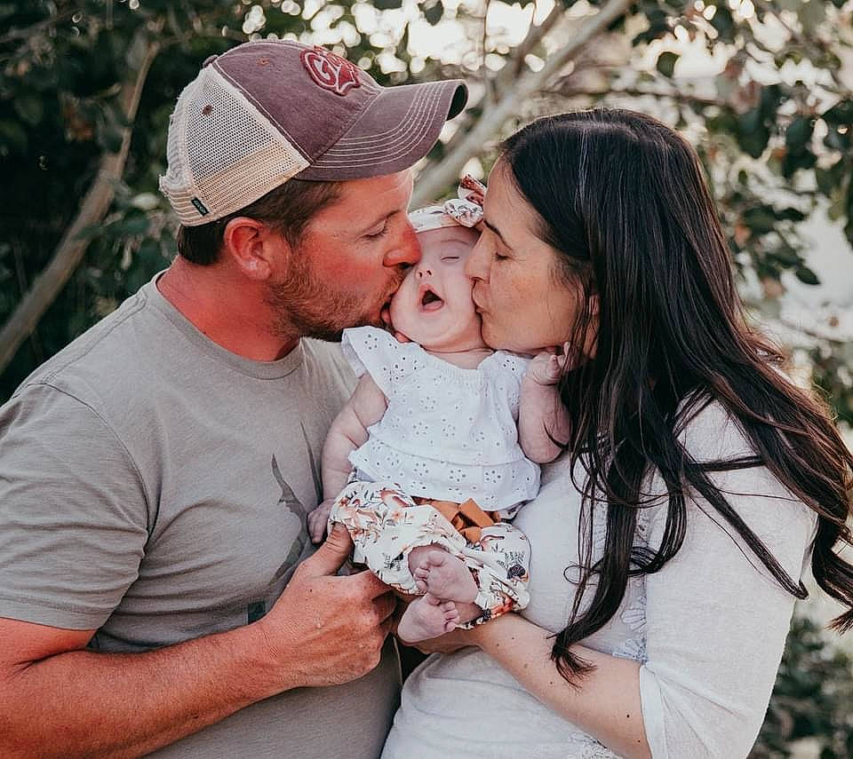 Brynlee is registered to the contest to win money with this photo: baby, baseball_cap, cap, child, event, fun, gesture, grass, happy, hat, headwear, hug, kiss, leaf, lip, people_in_nature, person, pink, romance, t_shirt