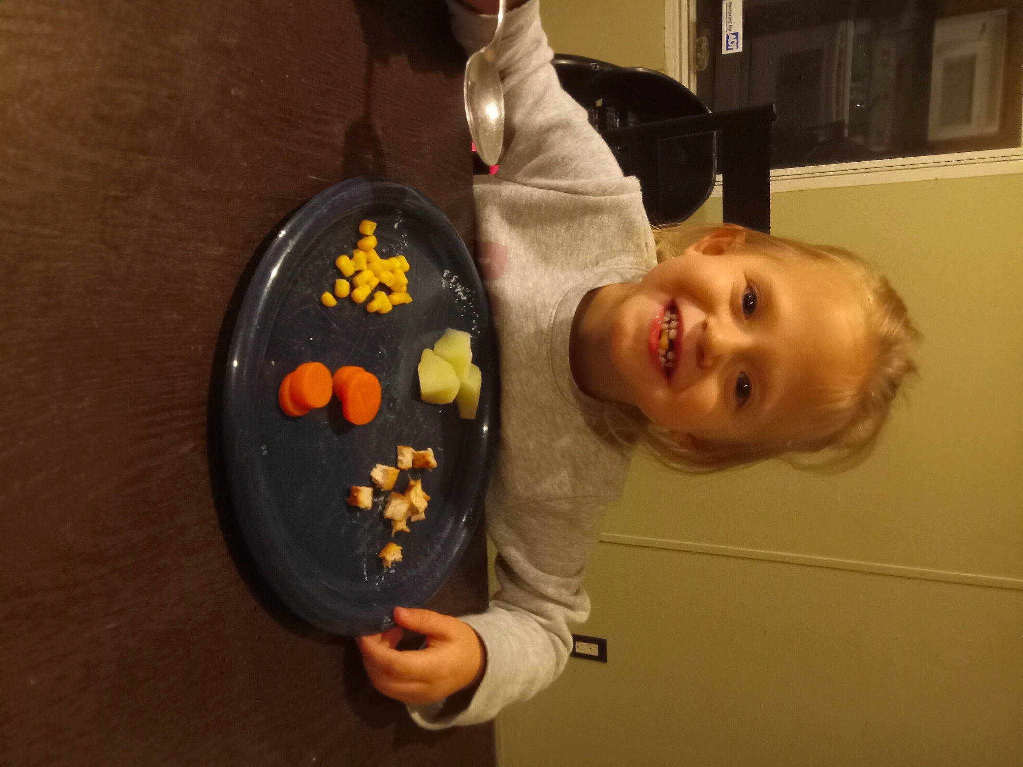 Kenslie is registered to the contest to win money with this photo: baby, baking, chair, child, comfort_food, cooking, facial_expression, finger_food, food, fun, happy, joy, person, plate, room, smile, sweetness, tableware, toddler