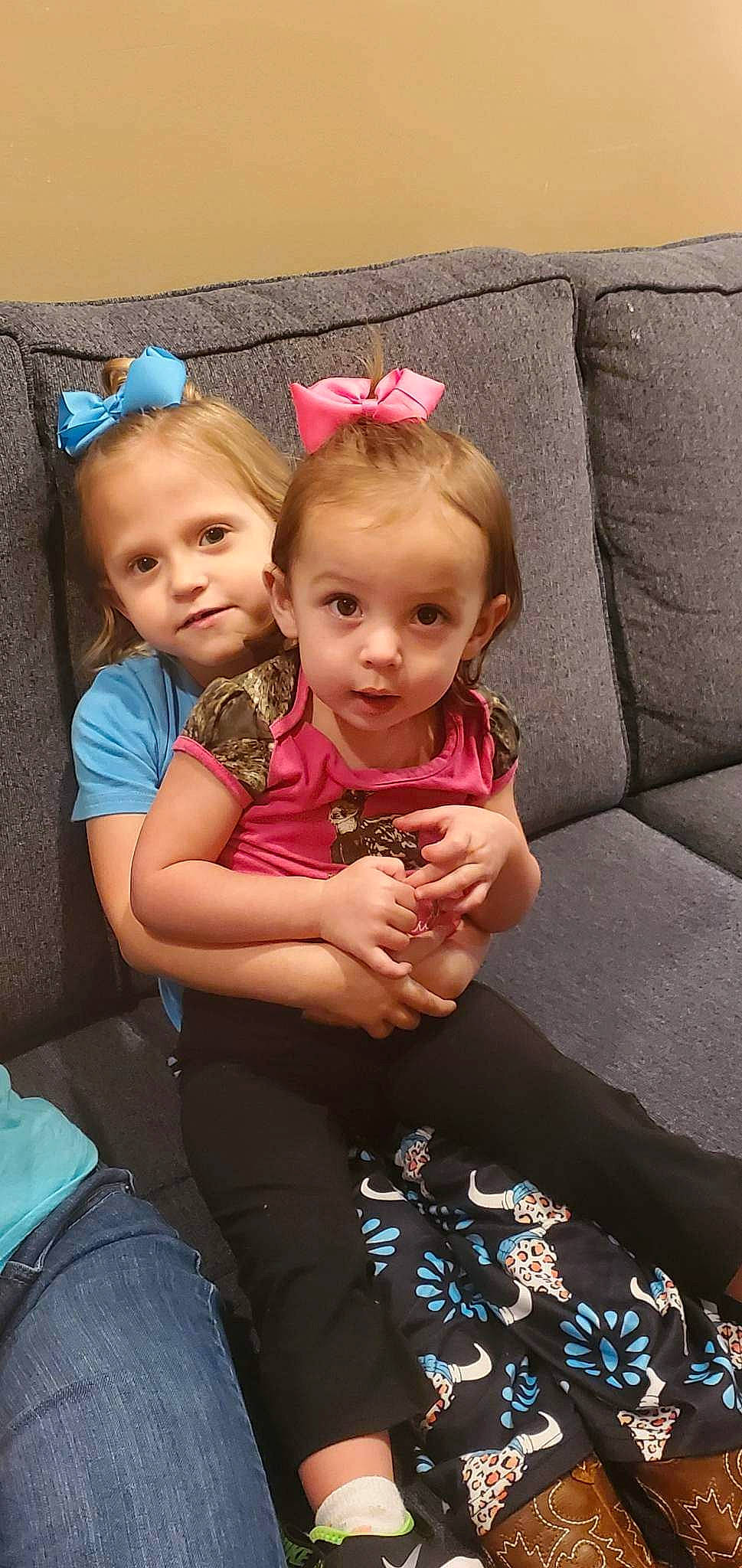 Kenslie is registered to the contest to win money with this photo: baby, baby_toddler_clothing, blond, cheek, child, comfort, couch, event, fun, gesture, happy, iris, lap, magenta, person, pink, sitting, skin, t_shirt, thumb