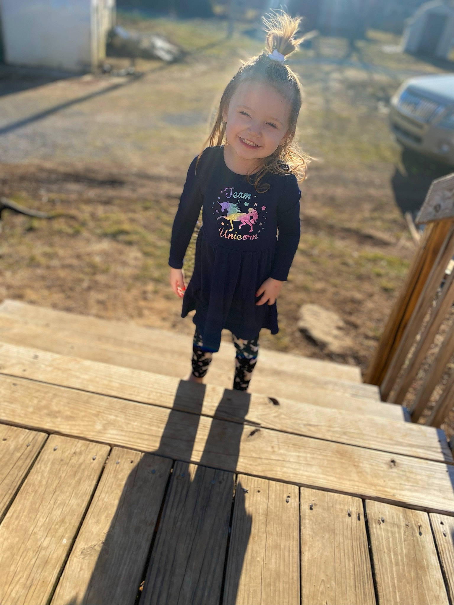 Kensley joined the competition — help win amazing prizes! baby_toddler_clothing, boardwalk, child, dress, flooring, fun, grass, happy, hardwood, head, joy, leisure, person, plank, smile, sunlight, t_shirt, tire, toddler, tree