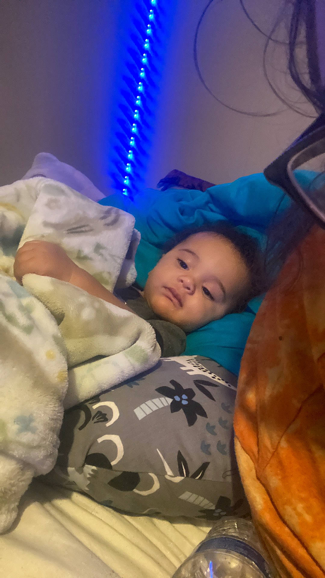 Jahvail is registered to the contest to win money with this photo: abdomen, baby, bedtime, child, comfort, couch, electric_blue, hat, head, linens, nap, person, room, sitting, sleep, toddler, tree