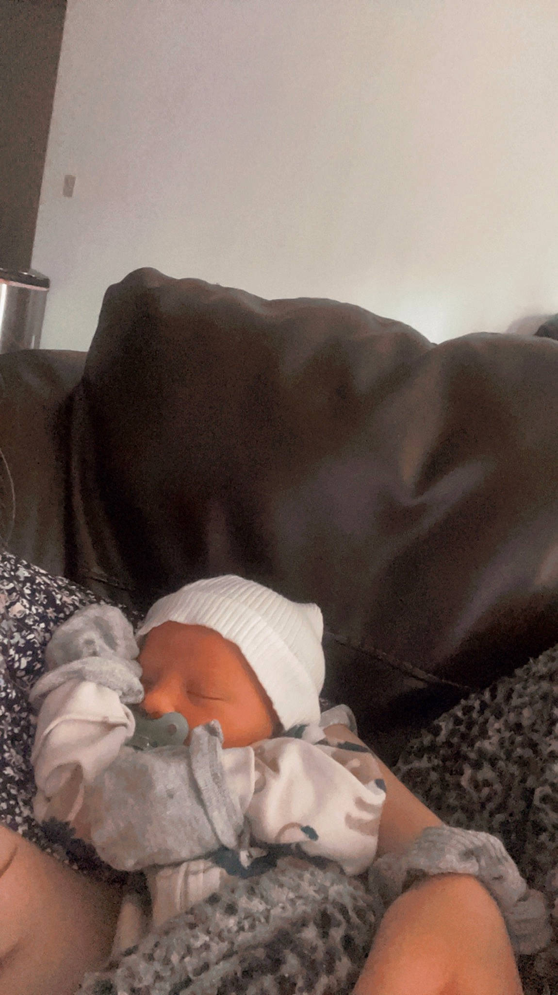 Brady is registered to the contest to win money with this photo: baby, baby_products, baby_sleeping, baby_toddler_clothing, bedding, bedtime, blanket, child, comfort, couch, human_leg, linens, nap, person, room, sitting, sleep, toddler