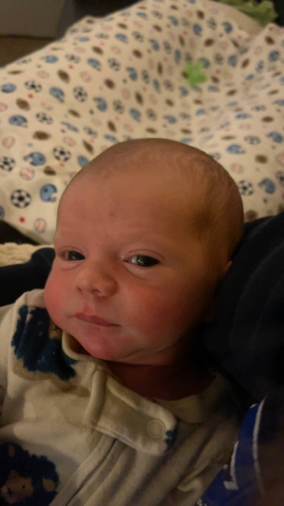 Brady is registered to the contest to win money with this photo: baby, baby_toddler_clothing, brown, cheek, child, comfort, ear, eye, eyebrow, eyelash, head, iris, lip, mouth, nose, person, skin, sleeve, smile, textile