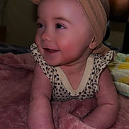 Wrenleigh joined the competition — help win amazing prizes! baby, child, smiling, headband, bow, blanket, pink, infant, cute, happy, lying_down, indoors, soft_texture, skin, cheeks, clothing, person, portrait, toddler, young_child