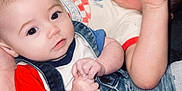 Wrenleigh joined the competition — help win amazing prizes! baby, child, couch, denim_overalls, hand, face, curious, playful, casual_clothing, indoor, person, infant, cute, relaxed, sitting, two_children, red_shirt, white_shirt, denim, soft_fabric