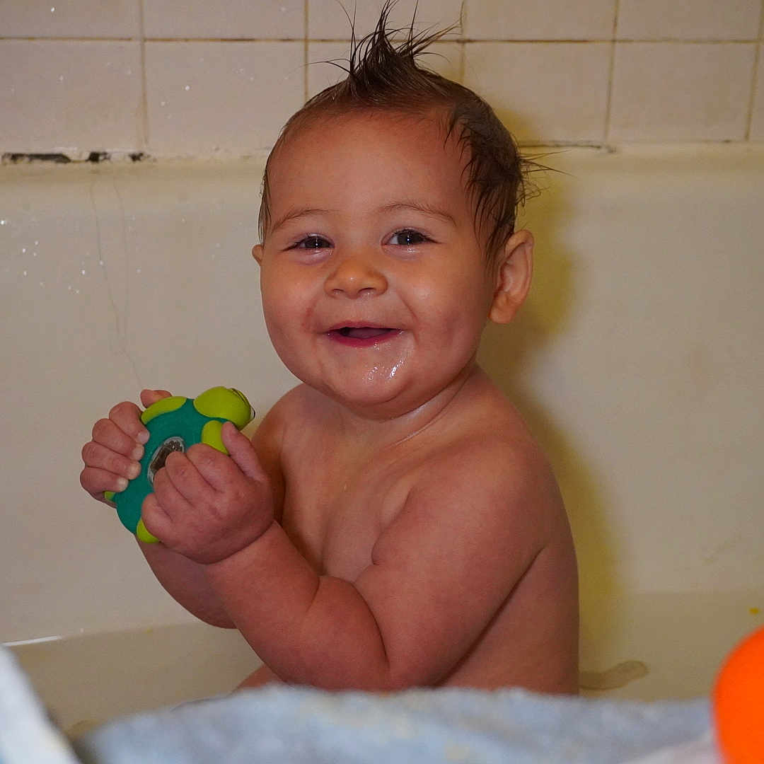 Lucas joined the competition — help win amazing prizes! baby, bath, bathtub, child, cute, face, fun, happy, indoors, moisture, moisturized_skin, plastic_toy, play, playful, portrait, smile, toy, water, wet, young_child