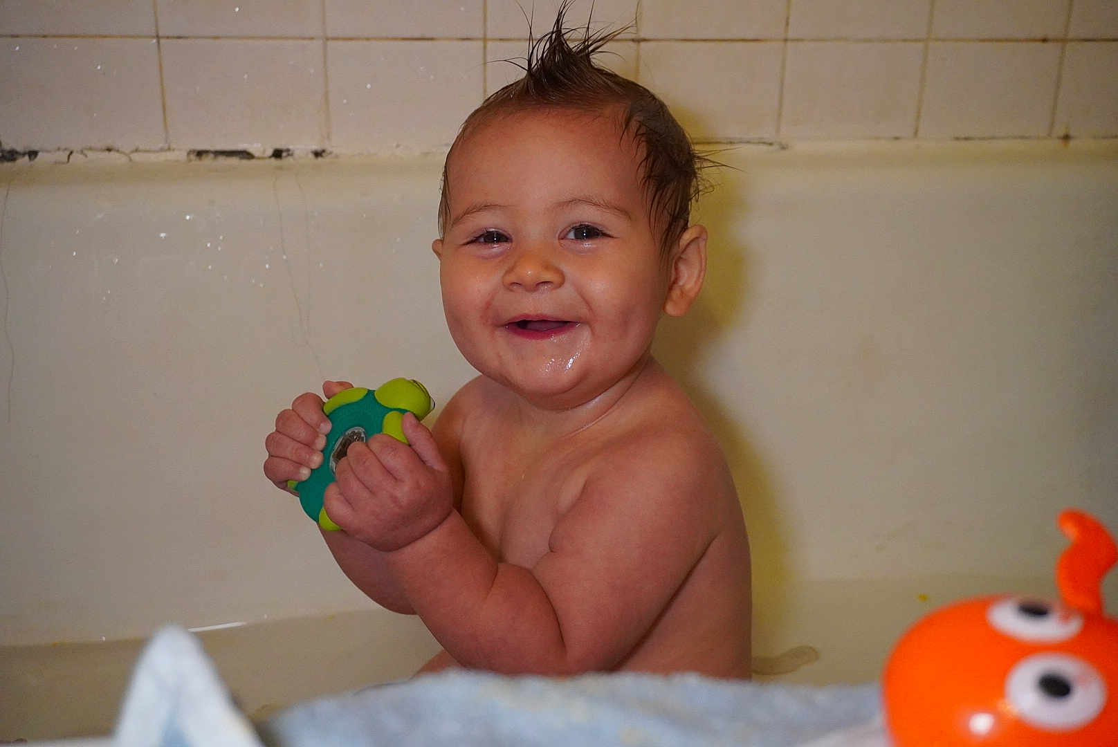 Lucas joined the competition — help win amazing prizes! baby, bathtub, bath, child, cute, face, fun, happy, indoors, moisture, moisturized_skin, play, playful, plastic_toy, portrait, smile, toy, water, wet, young_child