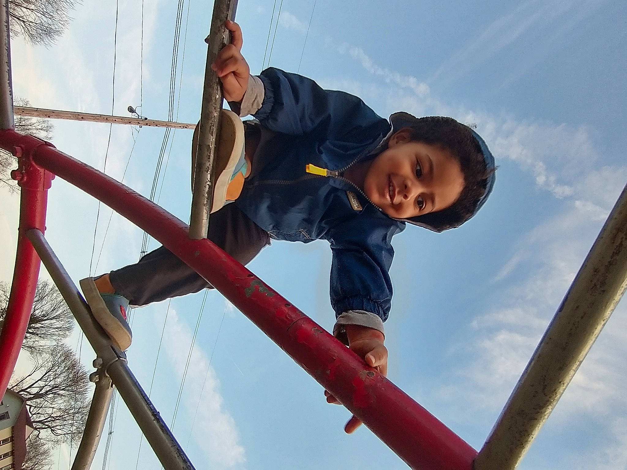 Gregory is registered to the contest to win money with this photo: cloud, composite_material, daytime, electric_blue, fun, happy, joy, leisure, outdoor_play_equipment, person, playground, recreation, sky, smile, toddler