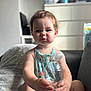 toddler, child, water_bottle, sitting, indoor, couch, blanket, expression, cute, face, clothing, person, furniture, home, soft_light, casual, bottle, young_child, baby, portrait