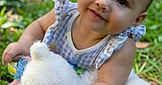 Durrann is registered to the contest to win money with this photo: baby, child, clothing, cute, daylight, grass, greenery, happy, infant, nature, outdoor, park, playful, portrait, sitting, smiling, stuffed_animal, sunlight, toy, young_child