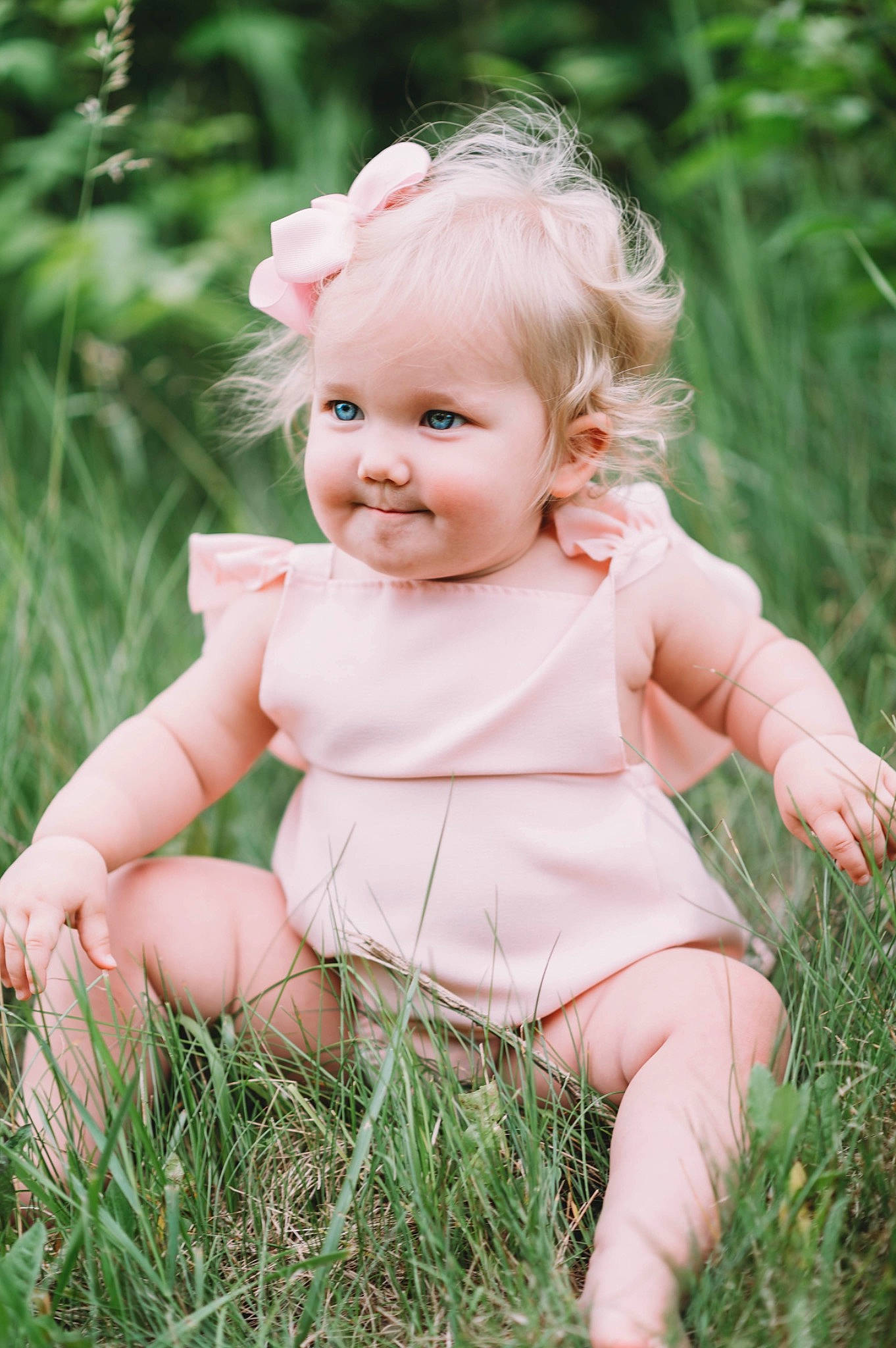 Theodora is registered to the contest to win money with this photo: baby, baby_toddler_clothing, cheek, child, clothing, eye, flash_photography, grass, happy, head, iris, joy, lip, meadow, people_in_nature, person, pink, plant, skin, smile