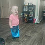 Rachel is registered to the contest to win money with this photo: accessories, bag, child, clothing, face, female, footwear, girl, handbag, hardwood, head, indoors, interiordesign, pants, person, photography, shelf, shoe, shorts, wood