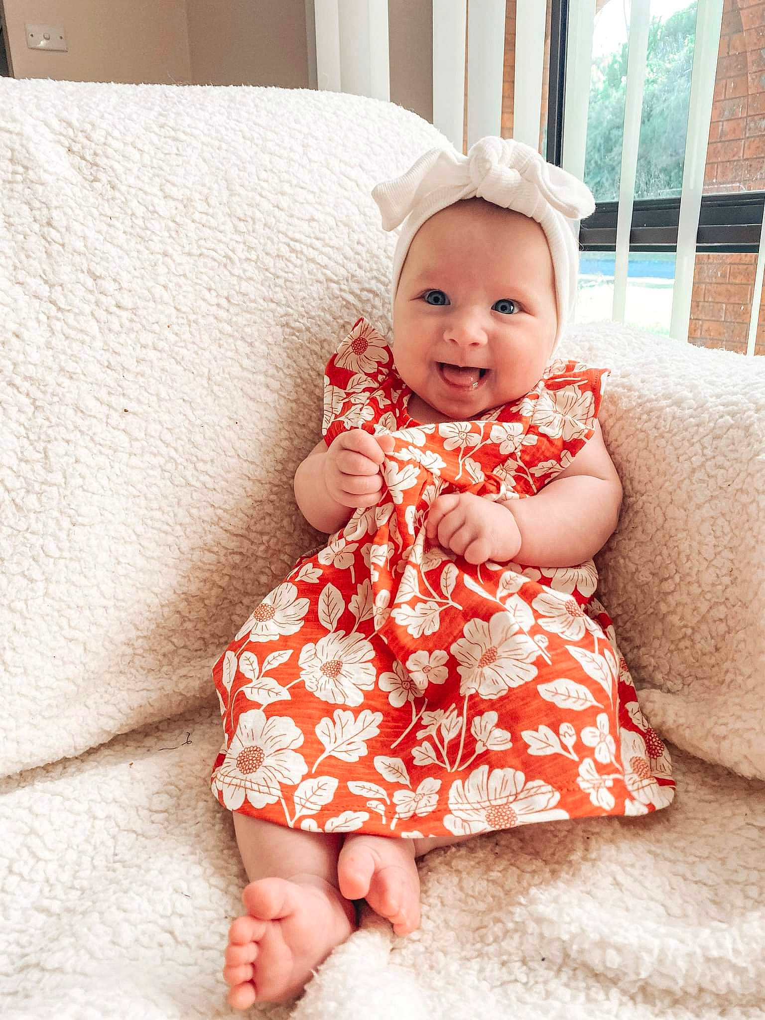 Lylah joined the competition — help win amazing prizes! baby, baby_toddler_clothing, child, comfort, couch, dress, finger, flash_photography, flooring, happy, headwear, linens, pattern, person, pink, sitting, skin, sleeve, smile, toddler