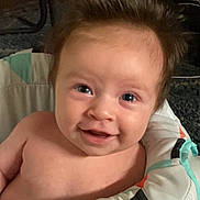 Grace is registered to the contest to win money with this photo: baby, babylaughing, blonde, bodypart, clothing, coat, face, hair, happy, head, jacket, laughing, mouth, newborn, person, photography, portrait, selfie, smile, teeth