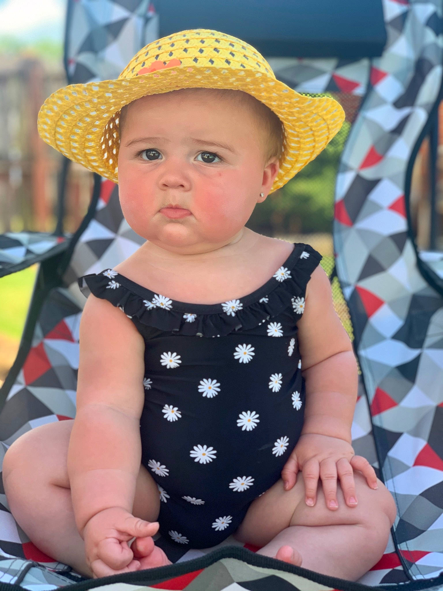 Allyah is registered to the contest to win money with this photo: baby, baby_products, baby_toddler_clothing, child, clothing, design, fashion_accessory, hat, headgear, headwear, pattern, person, polka_dot, product, sitting, summer, sun_hat, toddler, vacation