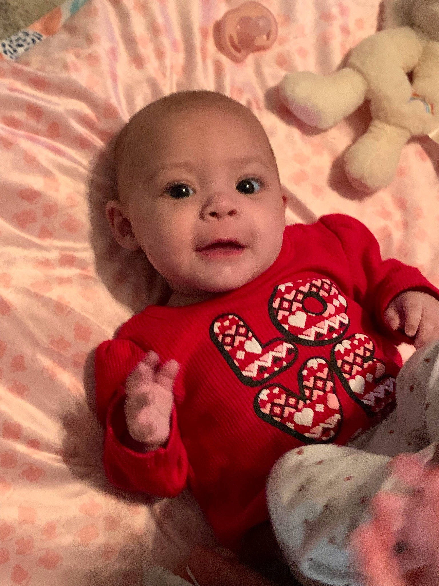 Isabel is registered to the contest to win money with this photo: baby, baby_toddler_clothing, cheek, child, chin, comfort, eye, happy, head, iris, linens, lip, mouth, nose, person, pink, skin, sleeve, smile, textile