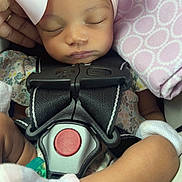Anaea joined the competition — help win amazing prizes! baby, blanket, car_seat, child, child_seat, closeup, cozy, cute, headband, infant, mittens, newborn, peaceful, pink_bow, portrait, relaxed, resting, safety_harness, sleeping, soft_lighting