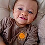 Maylonn participe au concours pour gagner de l'argent avec cette photo : blue_eyes, brown_hair, casual_clothing, child, closeup, comfort, couch, cushion, cute, face, happy, indoor, person, portrait, shirt, smiling, soft_texture, sun_graphic, toddler, young_child