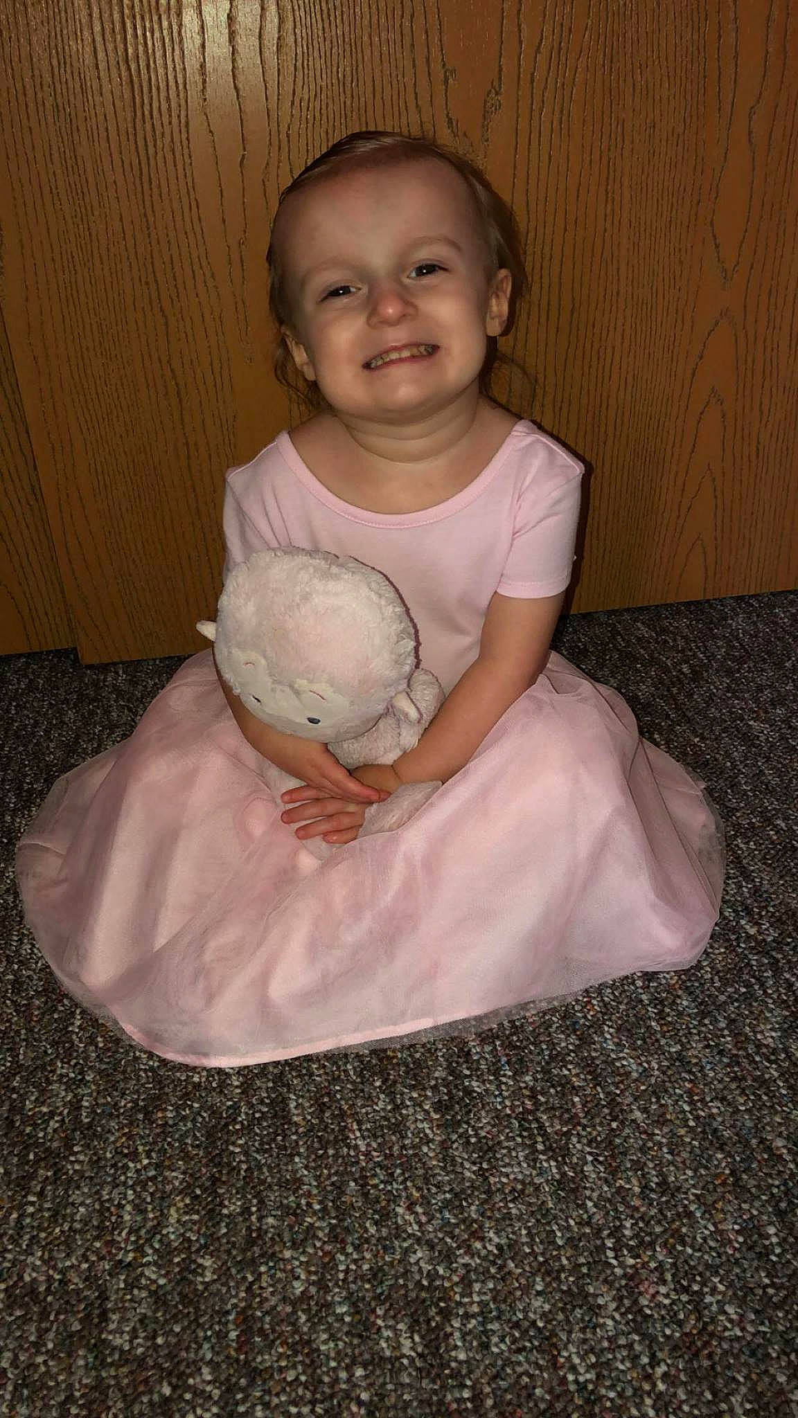 Scarlett is registered to the contest to win money with this photo: baby, baby_toddler_clothing, child, costume, dress, joy, person, sitting, toddler