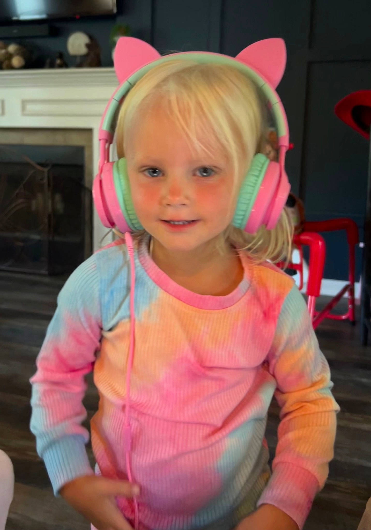 Harper is registered to the contest to win money with this photo: baby_toddler_clothing, chair, cheek, child, ear, event, eye, eyelash, fashion_accessory, fun, happy, headband, magenta, neck, person, pink, sitting, sleeve, smile, toddler